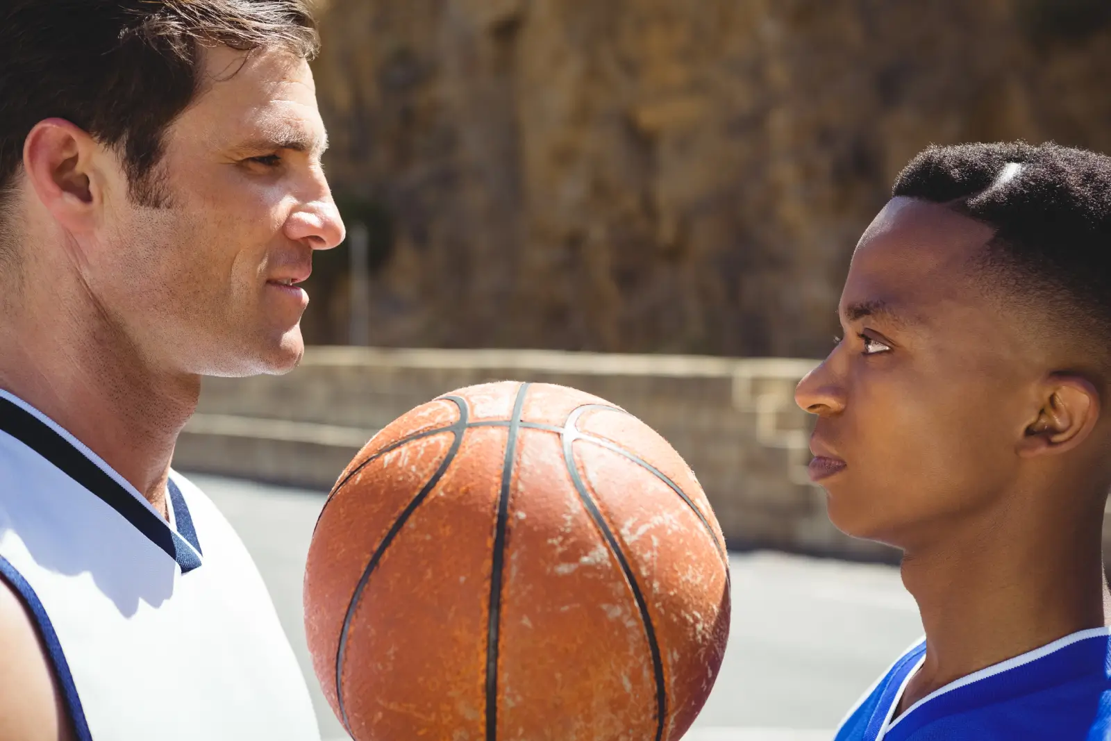 Coach and youth player communicating on court